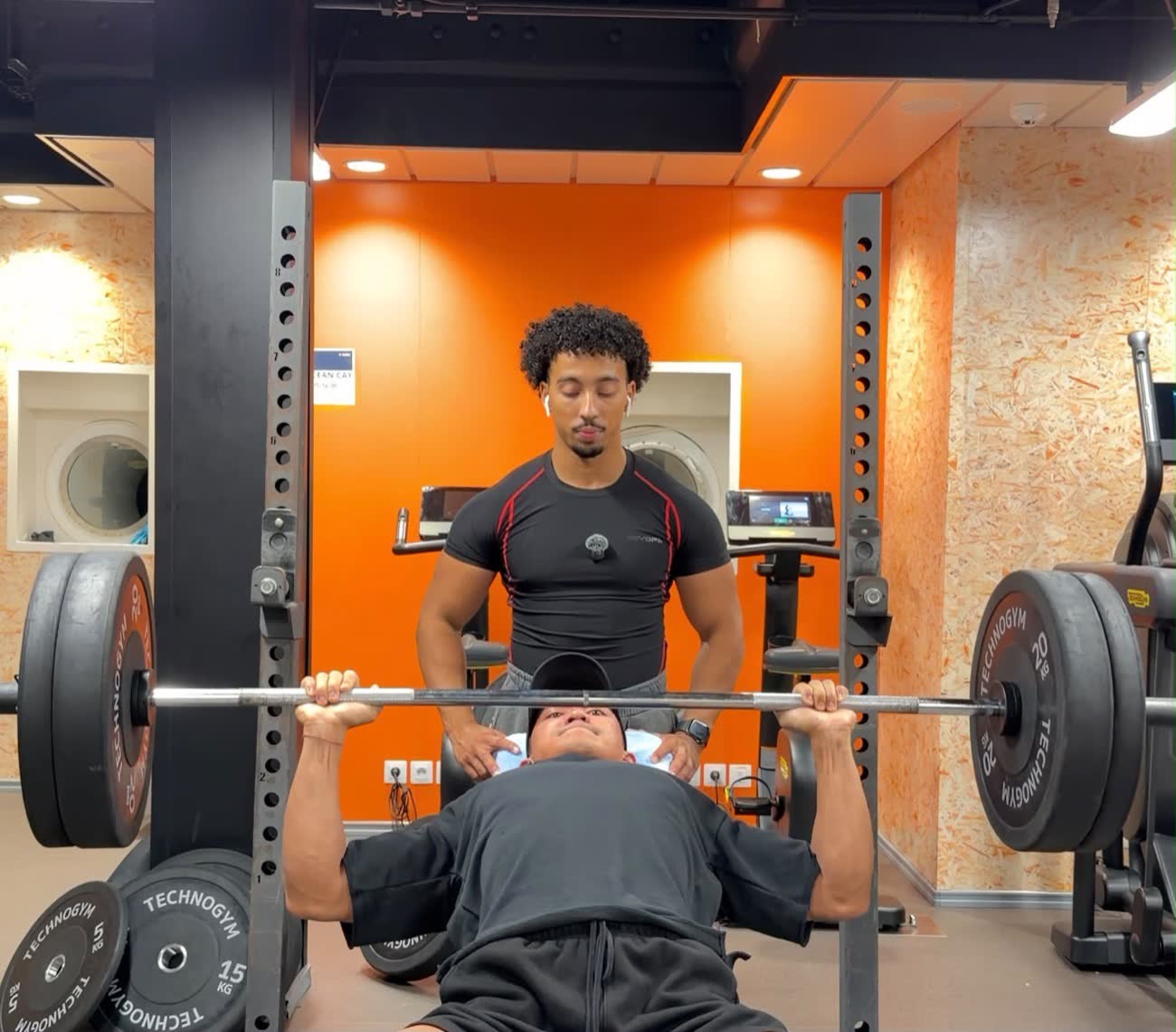 Ali coaching a client in the gym